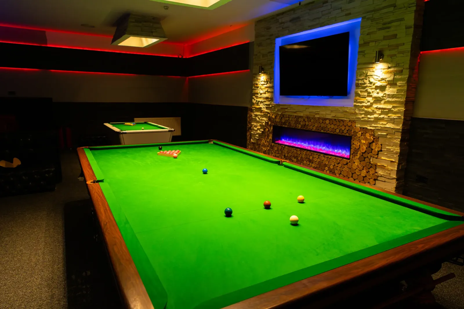 Snooker tables under lights at Frame 2 Complex